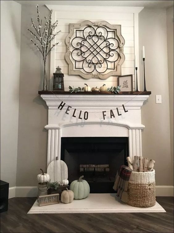 Fireplace mantel with fall decorations