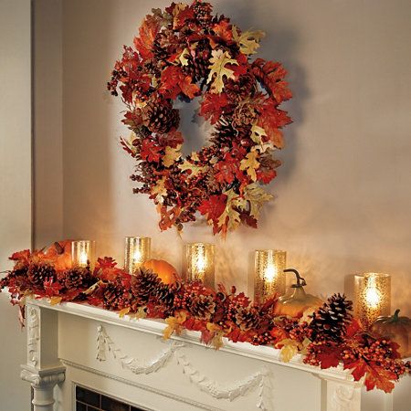 Fireplace mantel with Autumn leaves and candles